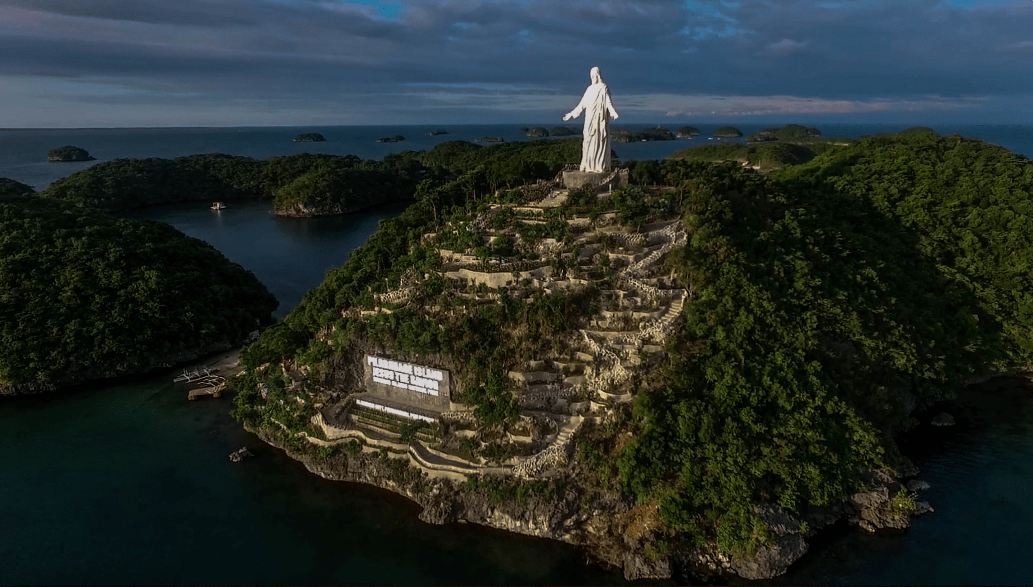 drone shot of jesus statue at pilgrimage island in hundred islands pangasinan philippines